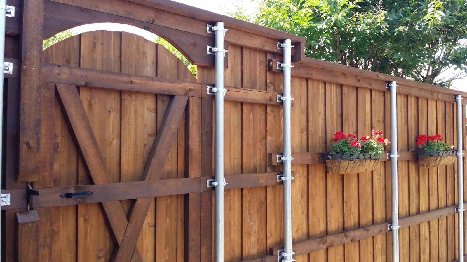Wood gate and privacy fence with flower planters